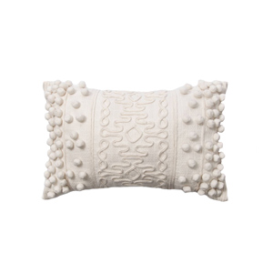 Ivory Embellished pom pom throw pillow for a cozy modern farmhouse living room design curated by Rare and Worthy Co